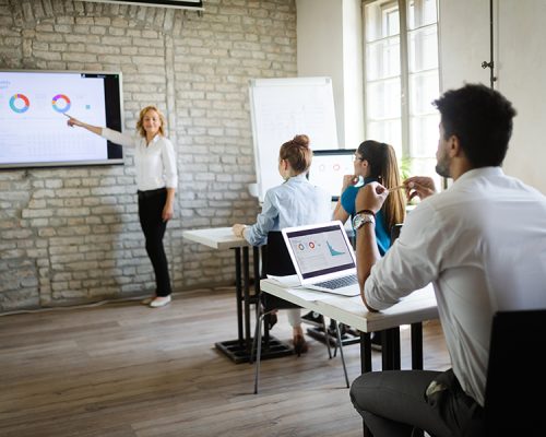 Business, technology and people concept - creative team or designers working on user interface at office